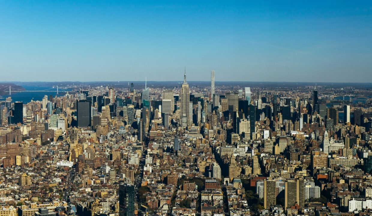 an aerial view of a city with tall buildings