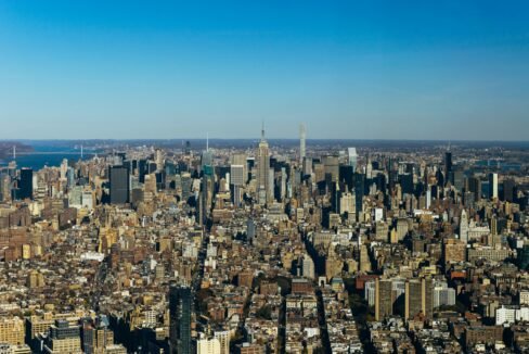 an aerial view of a city with tall buildings